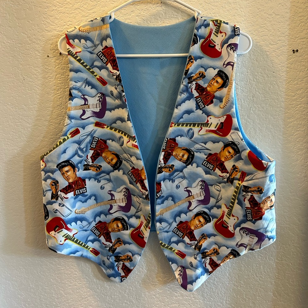 Hand made blue and multicoloured Elvis playing the guitar vest.
